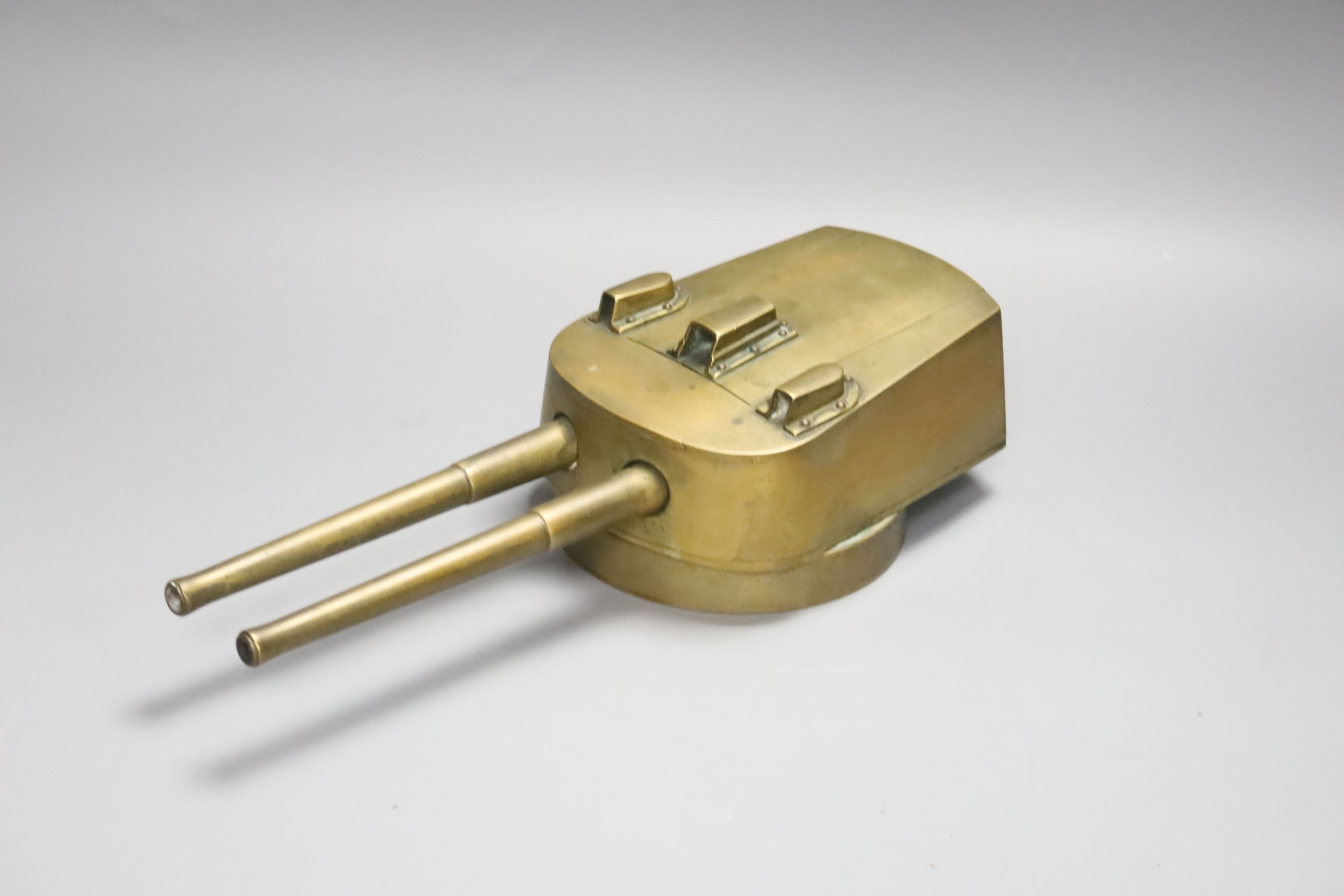 An early 20th century trench art gun turret cigarette case, cedar wood lining, 29cm